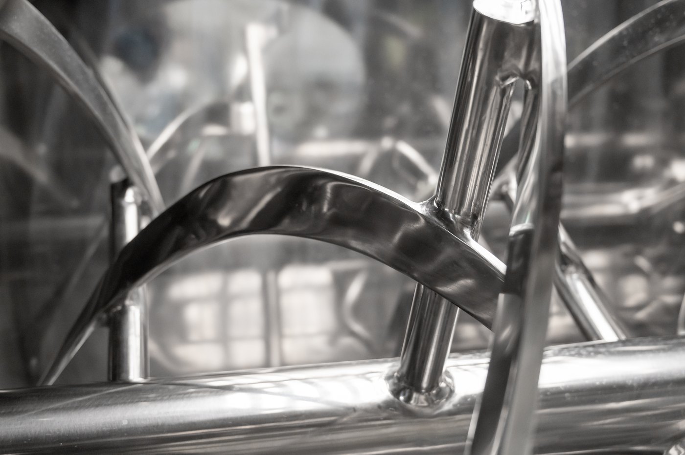 Close-up of QuantumX polished stainless double ribbon agitator flight geometry